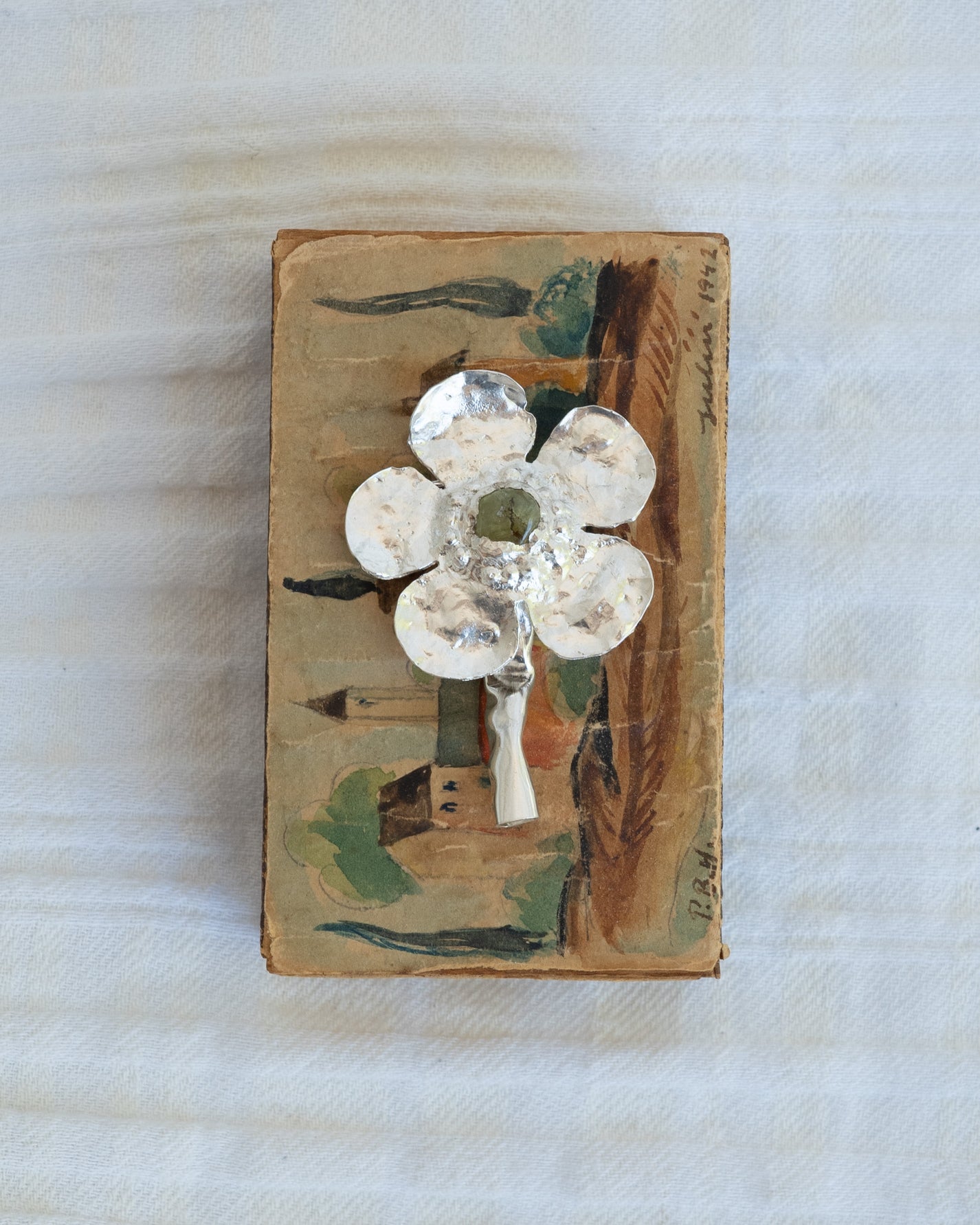 flower brooch with peridot