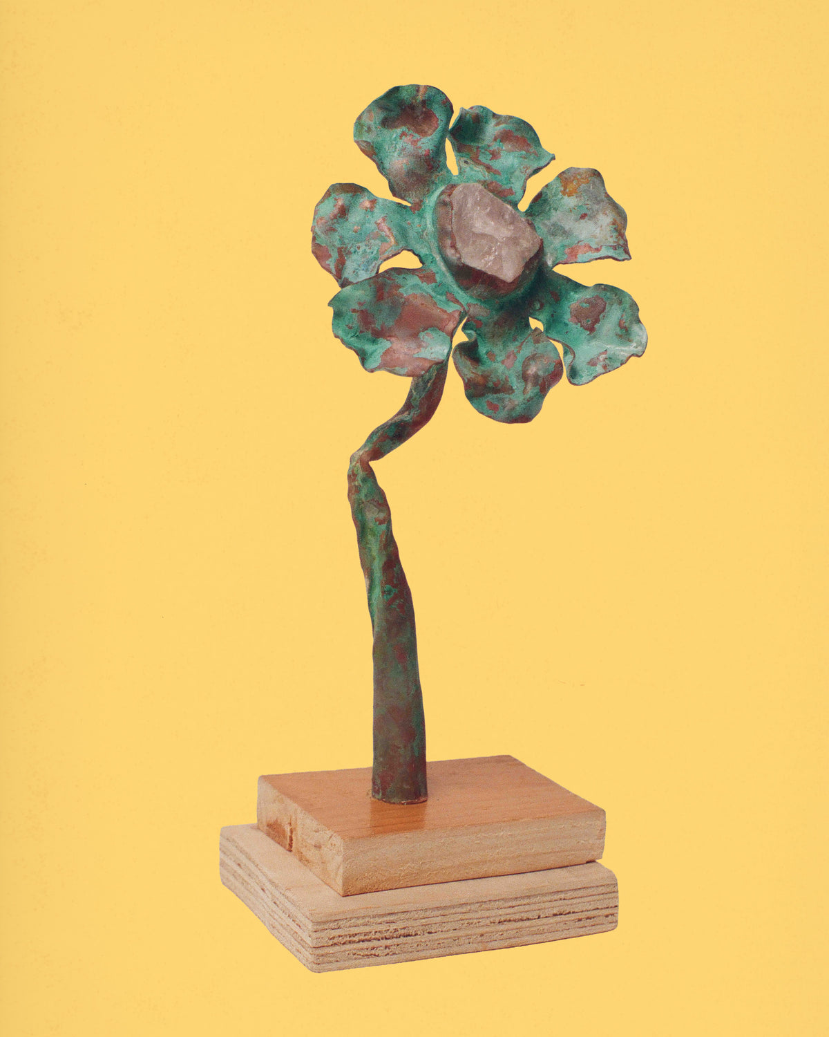 <p>flower sculpture made for kadeau. this one is made in oxidised copper with a rose quartz. </p>