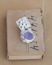 earringed with an amethyst