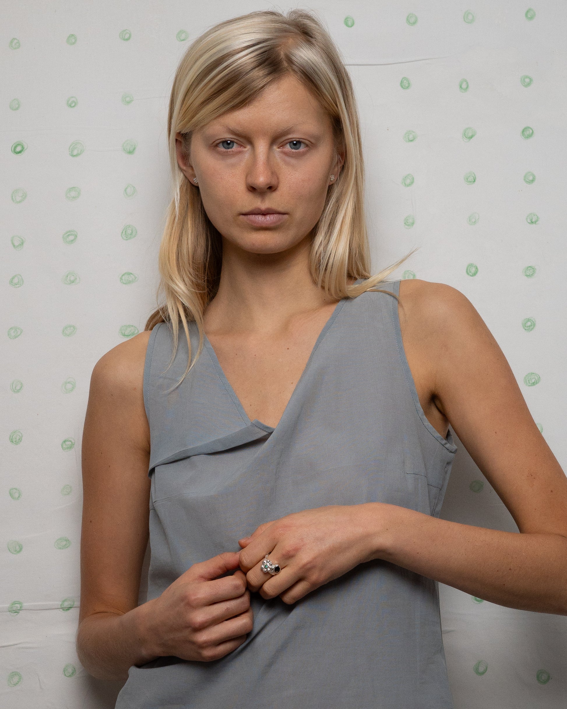 birgits finger with a green emerald and a smoky quartz