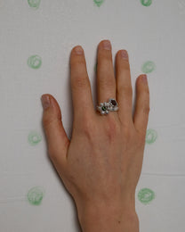 birgits finger with a green tourmaline and a piece of amber