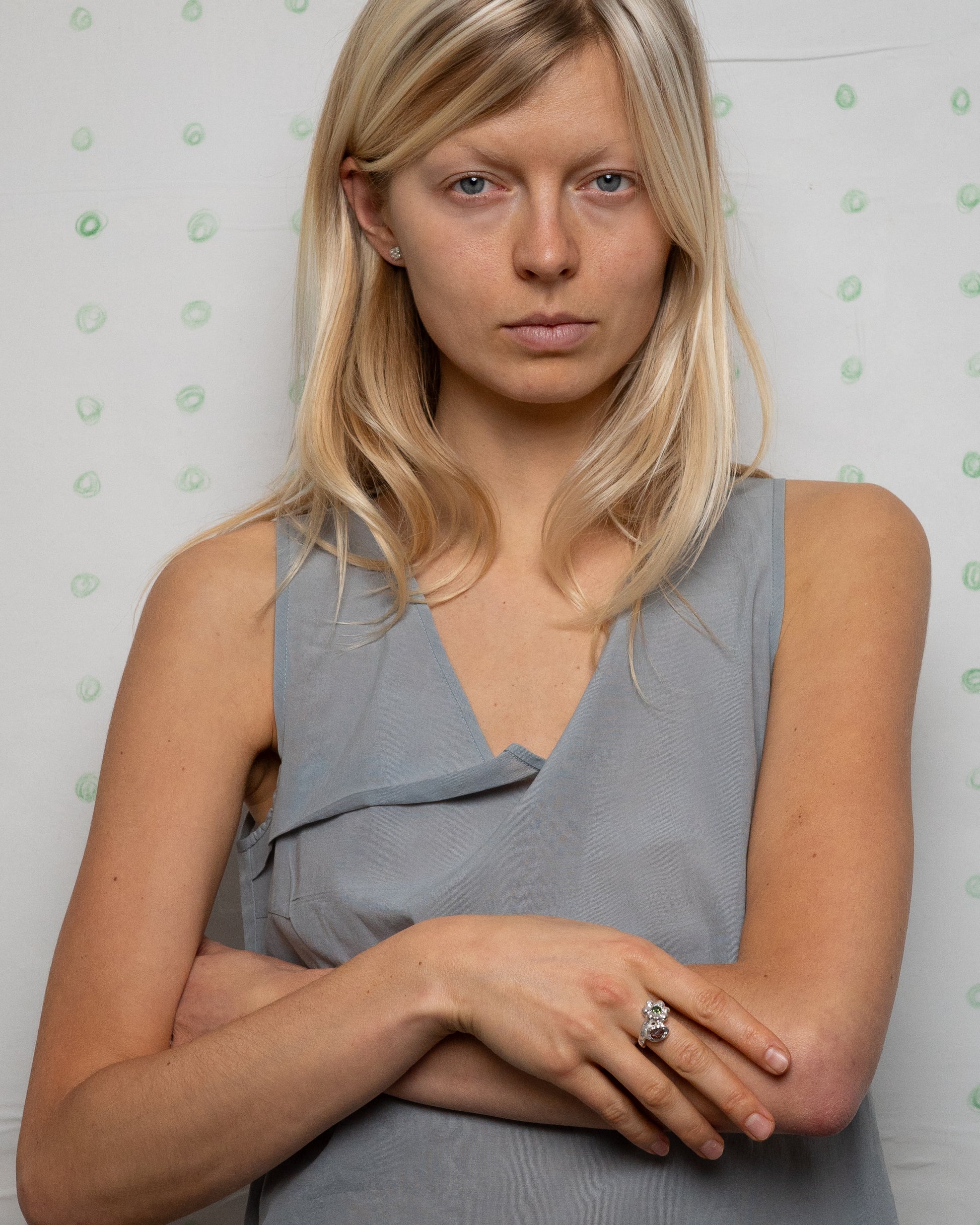 birgits finger with a green tourmaline and a piece of amber