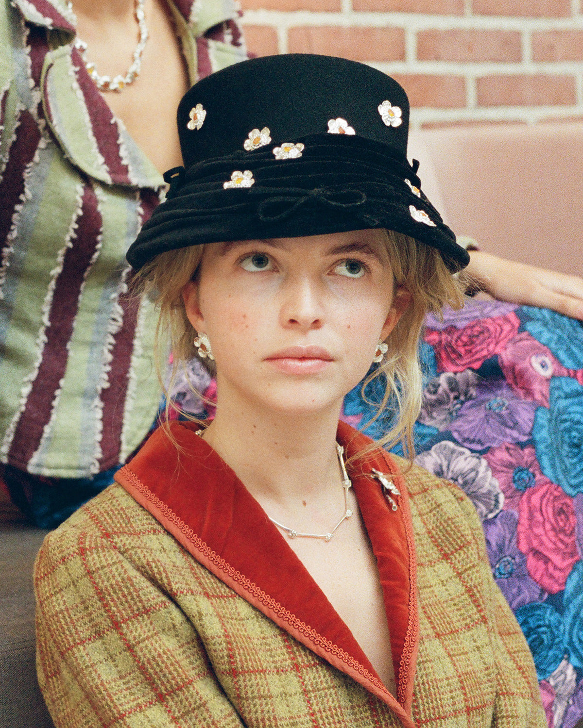 <p>caroline wearing a vintage hat filled with the <a href="/products/lille-yvonne-with-amber" target="_blank" title="ida with amber">ida earrings.</a></p>