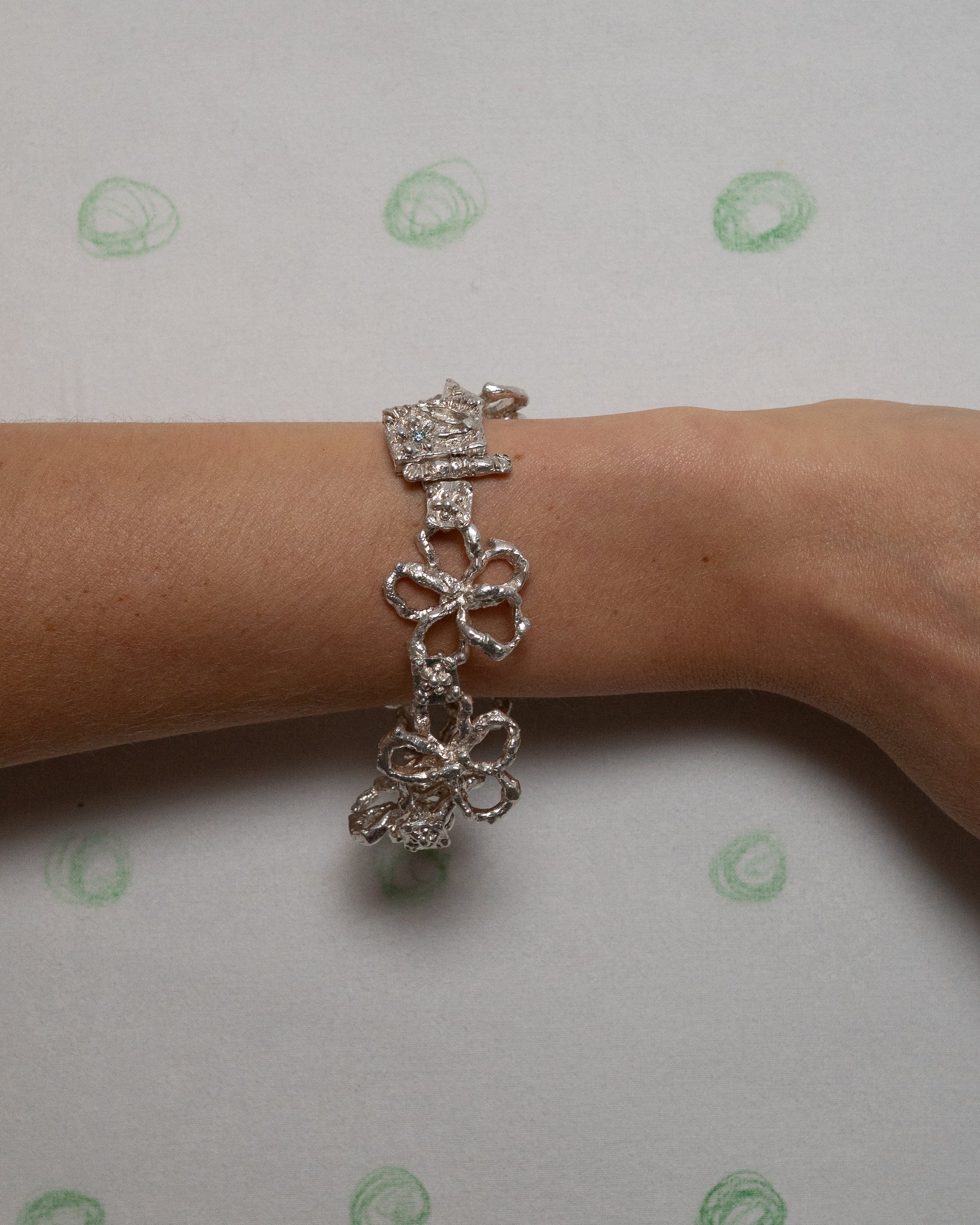 book of flowers with a blue sapphire