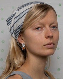 earringed with a small piece of amber