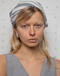 earringed with a small piece of amber