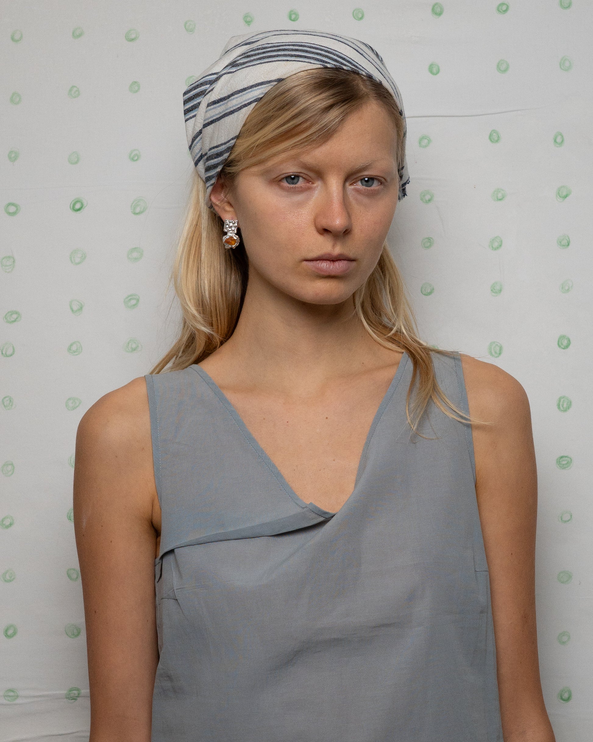 earringed with a small piece of amber