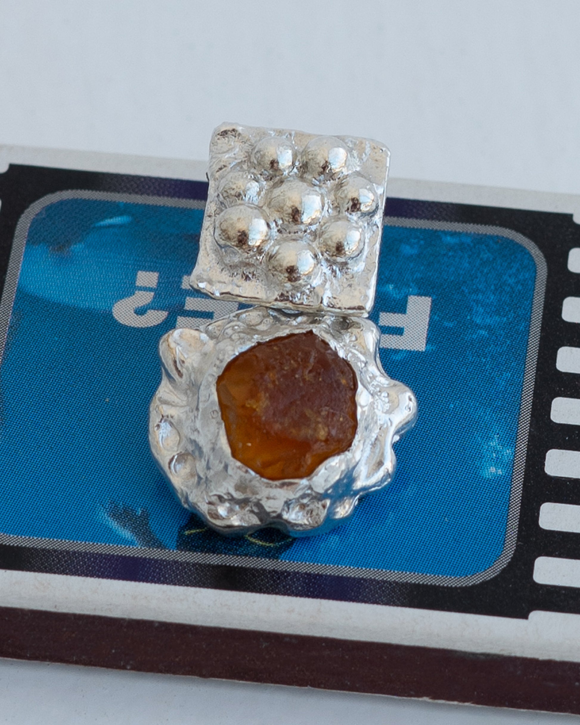 earringed with amber