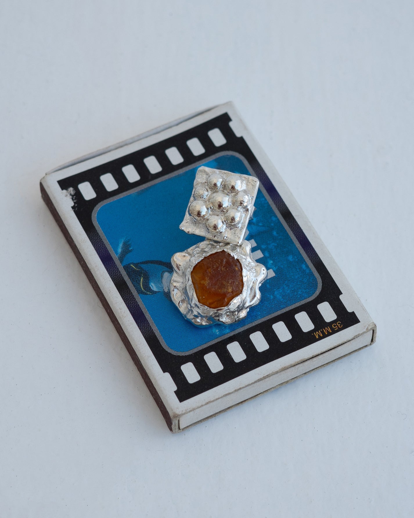 earringed with amber