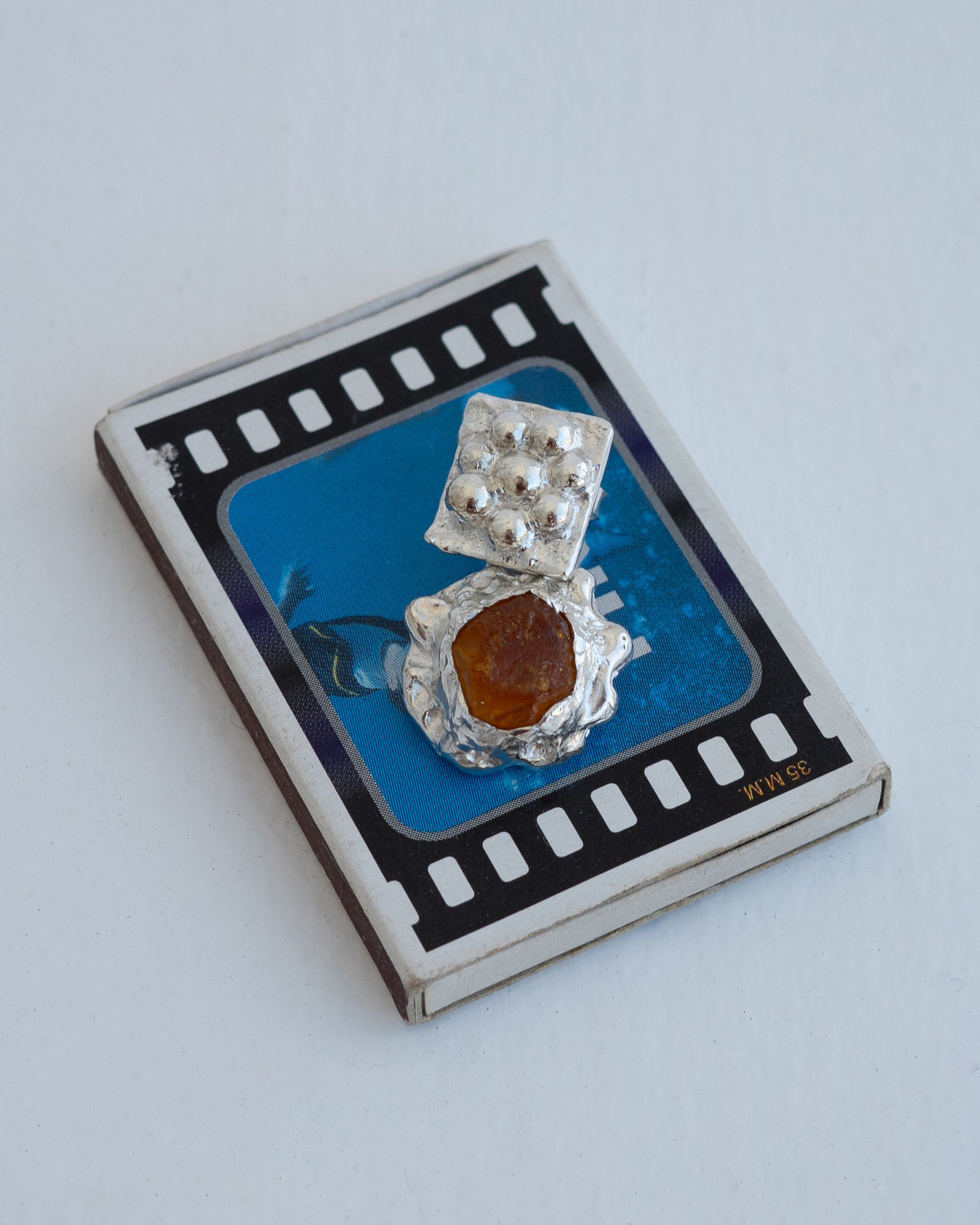 earringed with amber