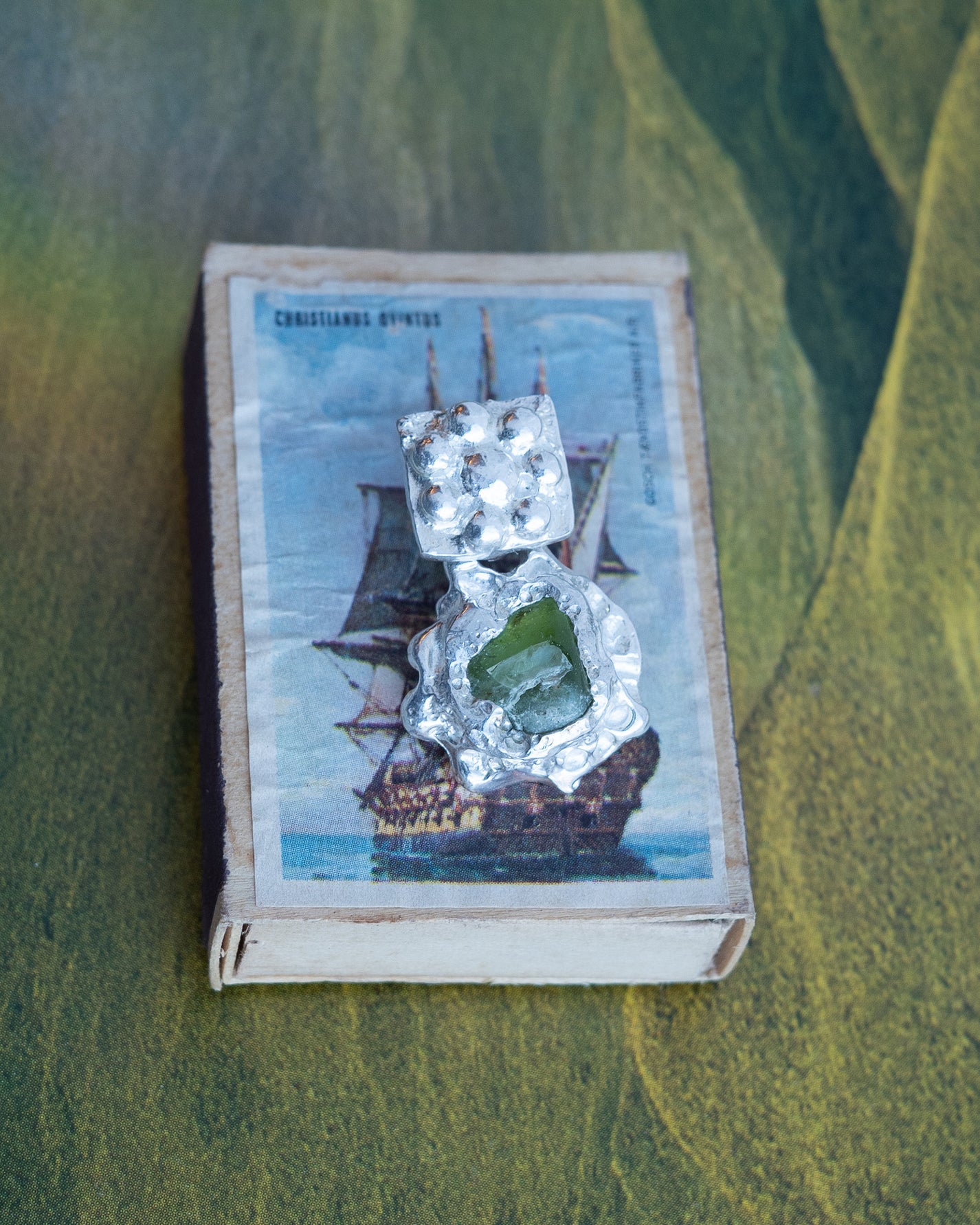 earringed with peridot