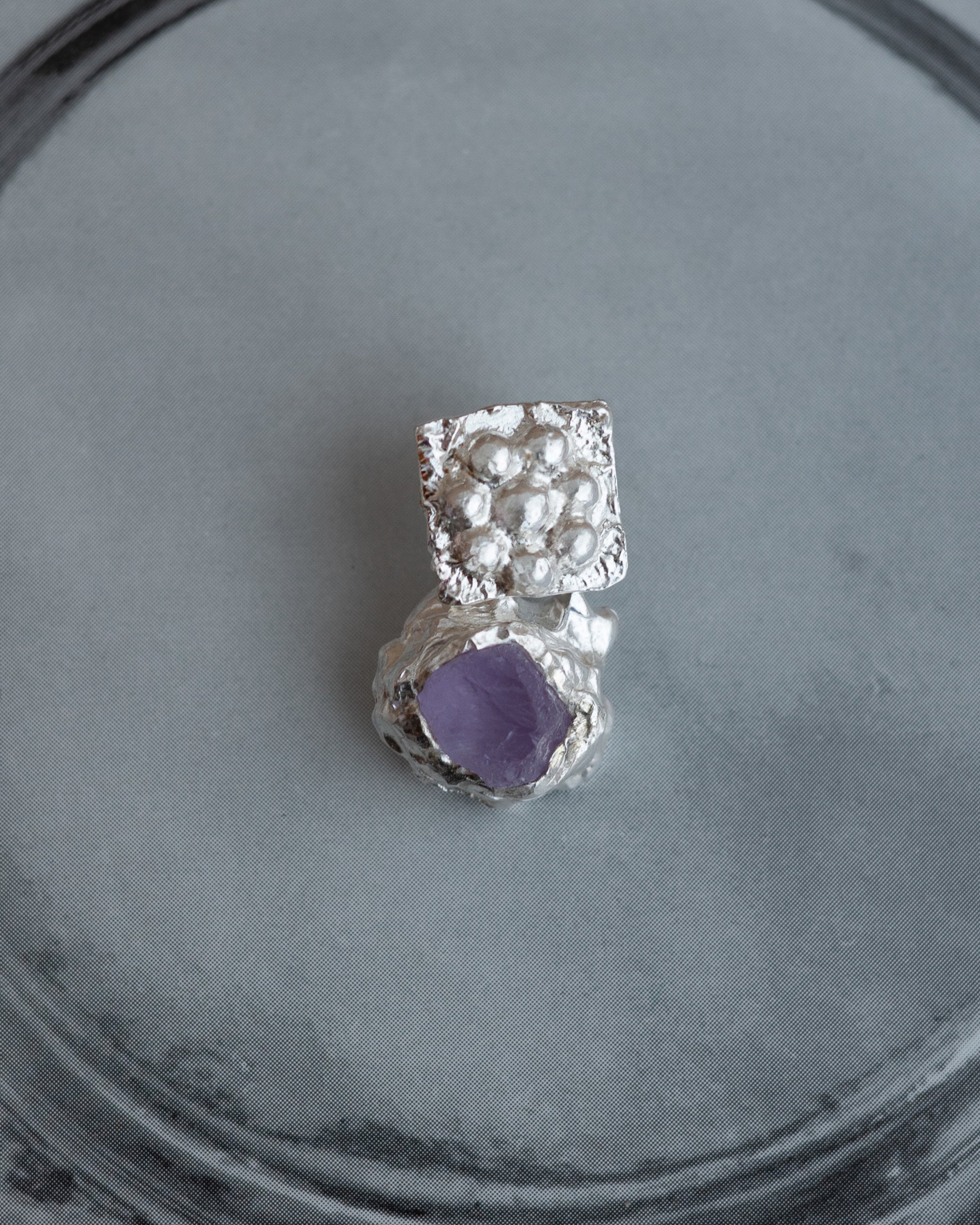 earringed with an amethyst