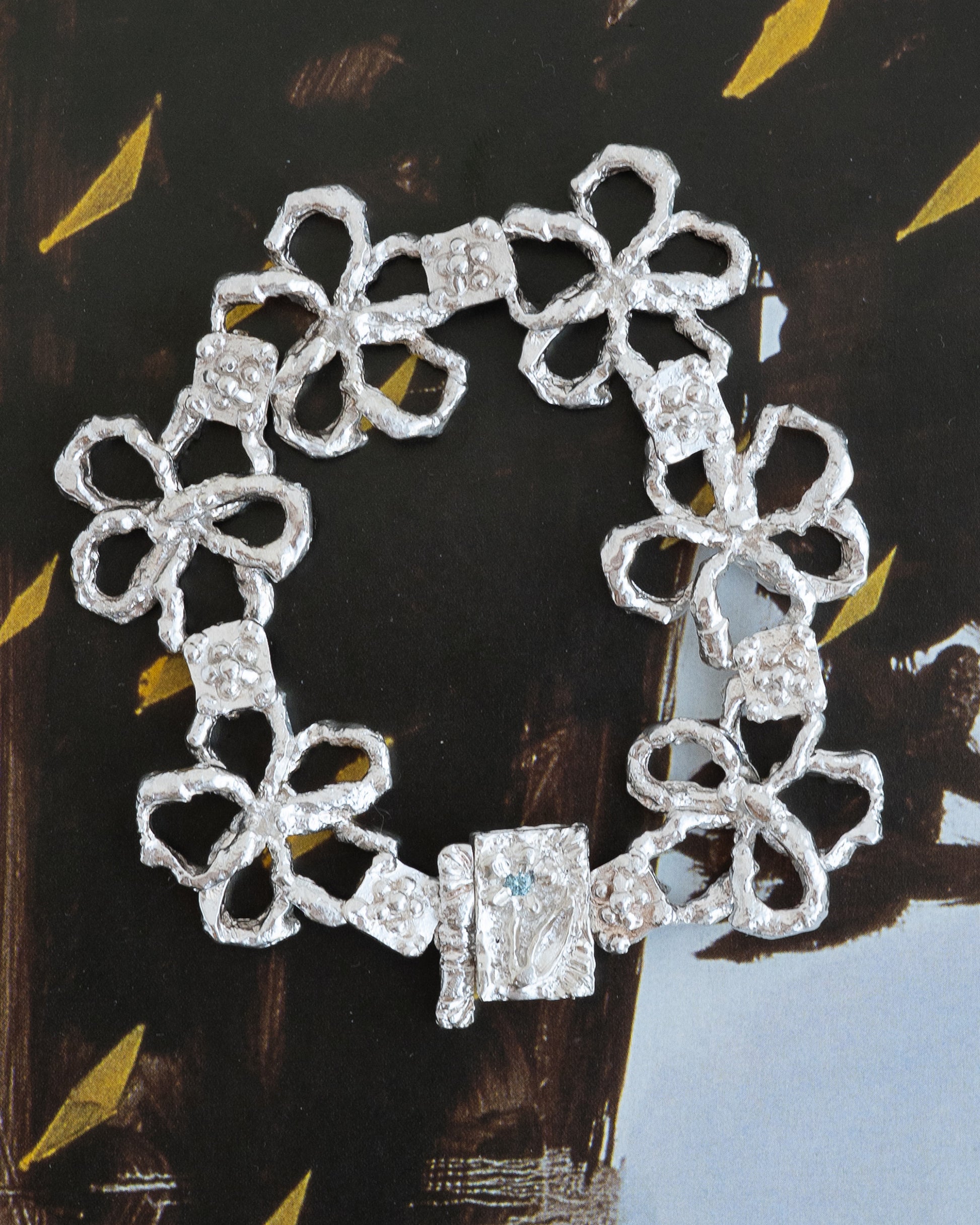 book of flowers with a blue diamond