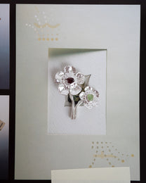 flowers in bloom with peridot and garnet