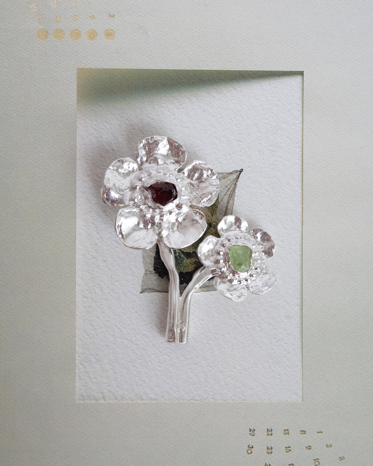flowers in bloom with peridot and garnet