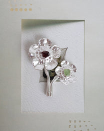 flowers in bloom with peridot and garnet