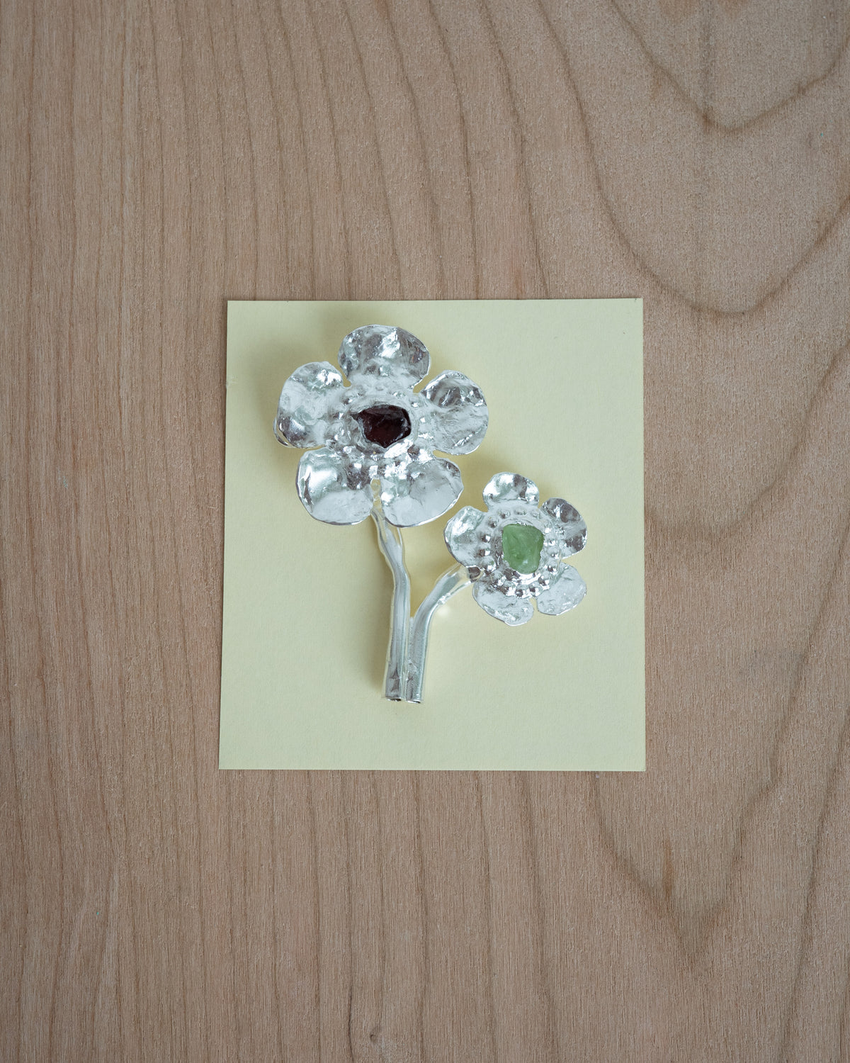 flowers in bloom with peridot and garnet