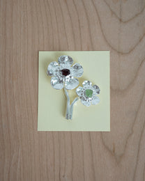 flowers in bloom with peridot and garnet