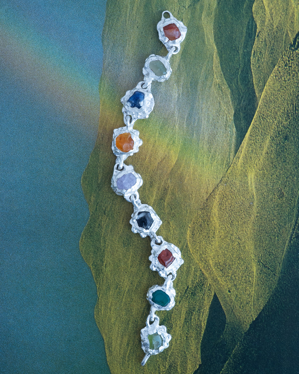 <p>gummi bracelet in 925 sterling silver, set with different gemstones. </p>