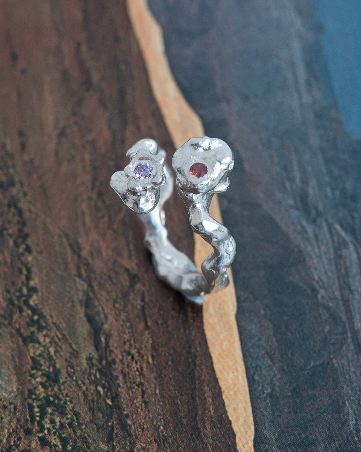 kasper with an orange and pink sapphire