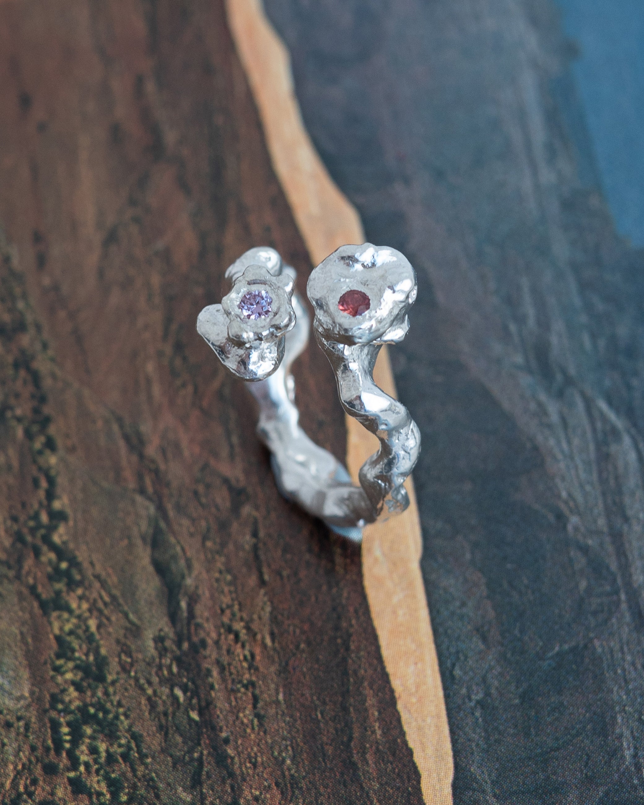 kasper with an orange and pink sapphire