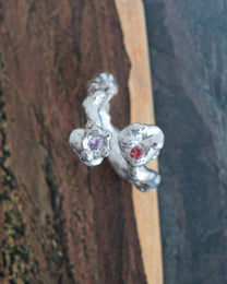 kasper with an orange and pink sapphire