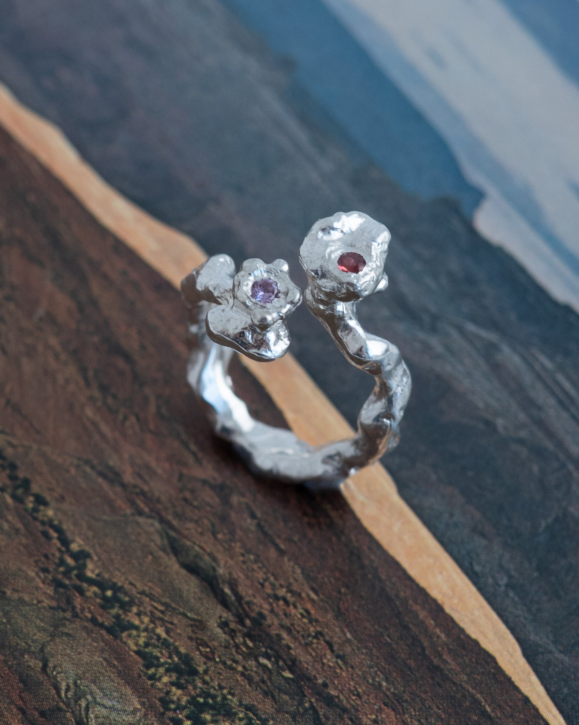 kasper with an orange and pink sapphire