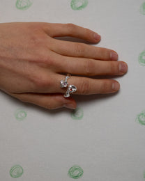 kasper with an orange and pink sapphire