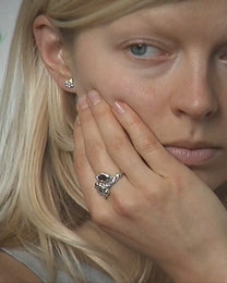 birgits finger with a green tourmaline and a piece of amber