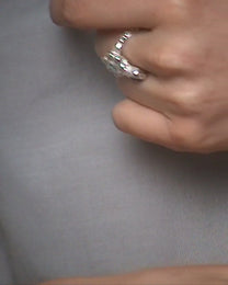 birgits finger with a green emerald and a smoky quartz