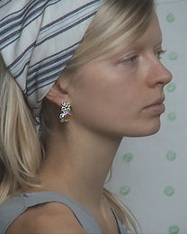 earringed with a small piece of amber