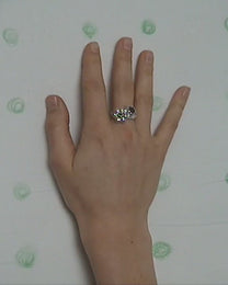 birgits finger with a green tourmaline and a piece of amber