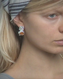 earringed with a small piece of amber